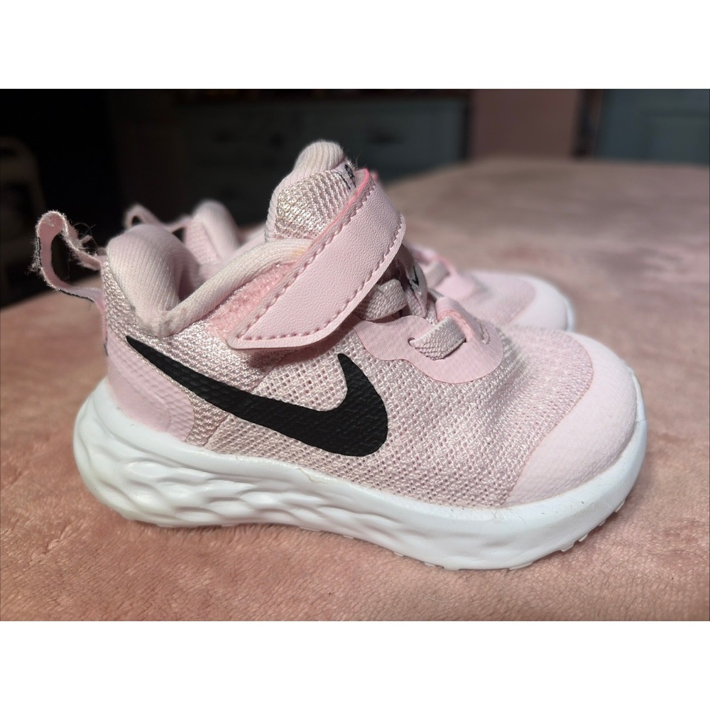Infant Girls Nike Revolution Sz 4C. Light Pink With Black Swoosh.